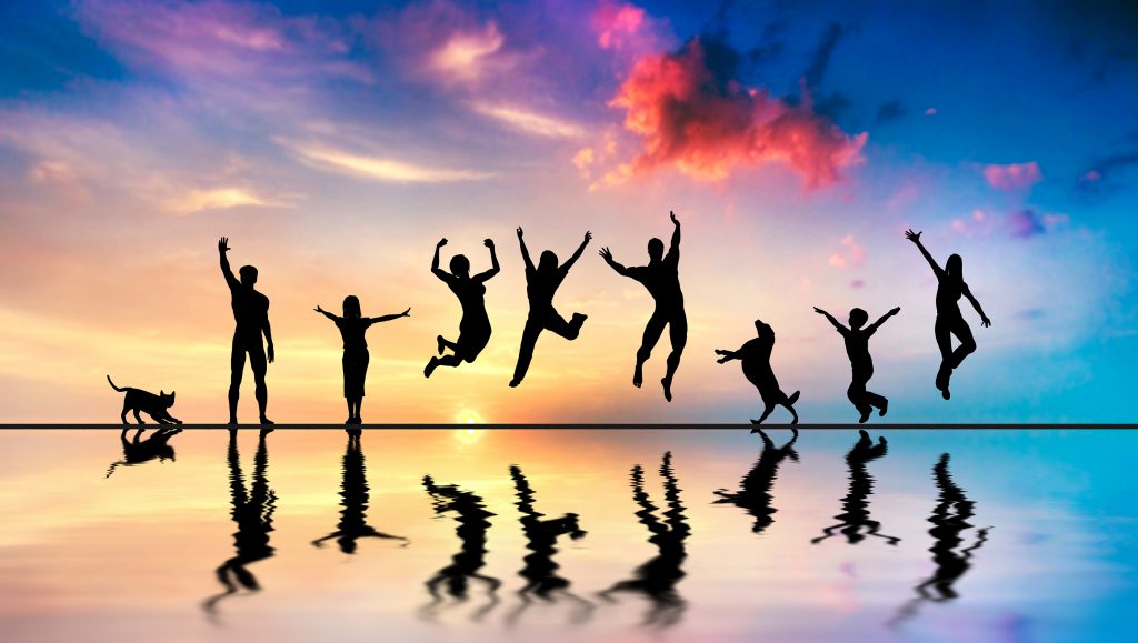 Happy group of friends, family with dog and cat jumping together